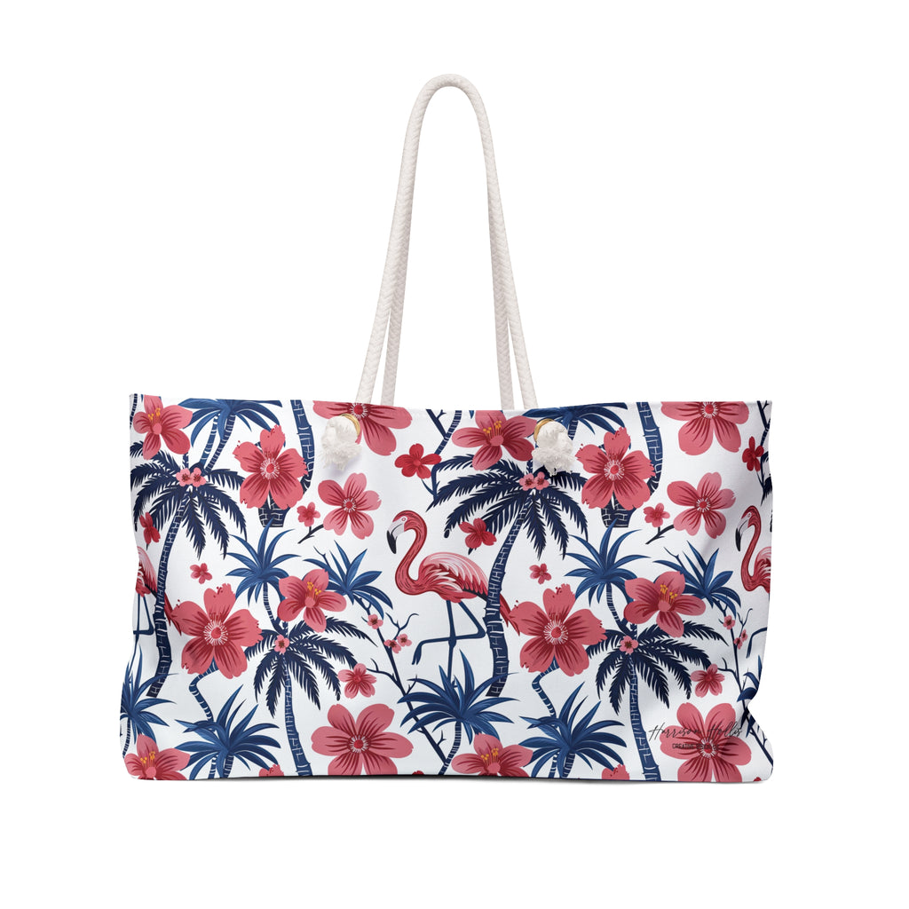 A weekender bag with rope handles, featuring pink flamingos with blue palm trees